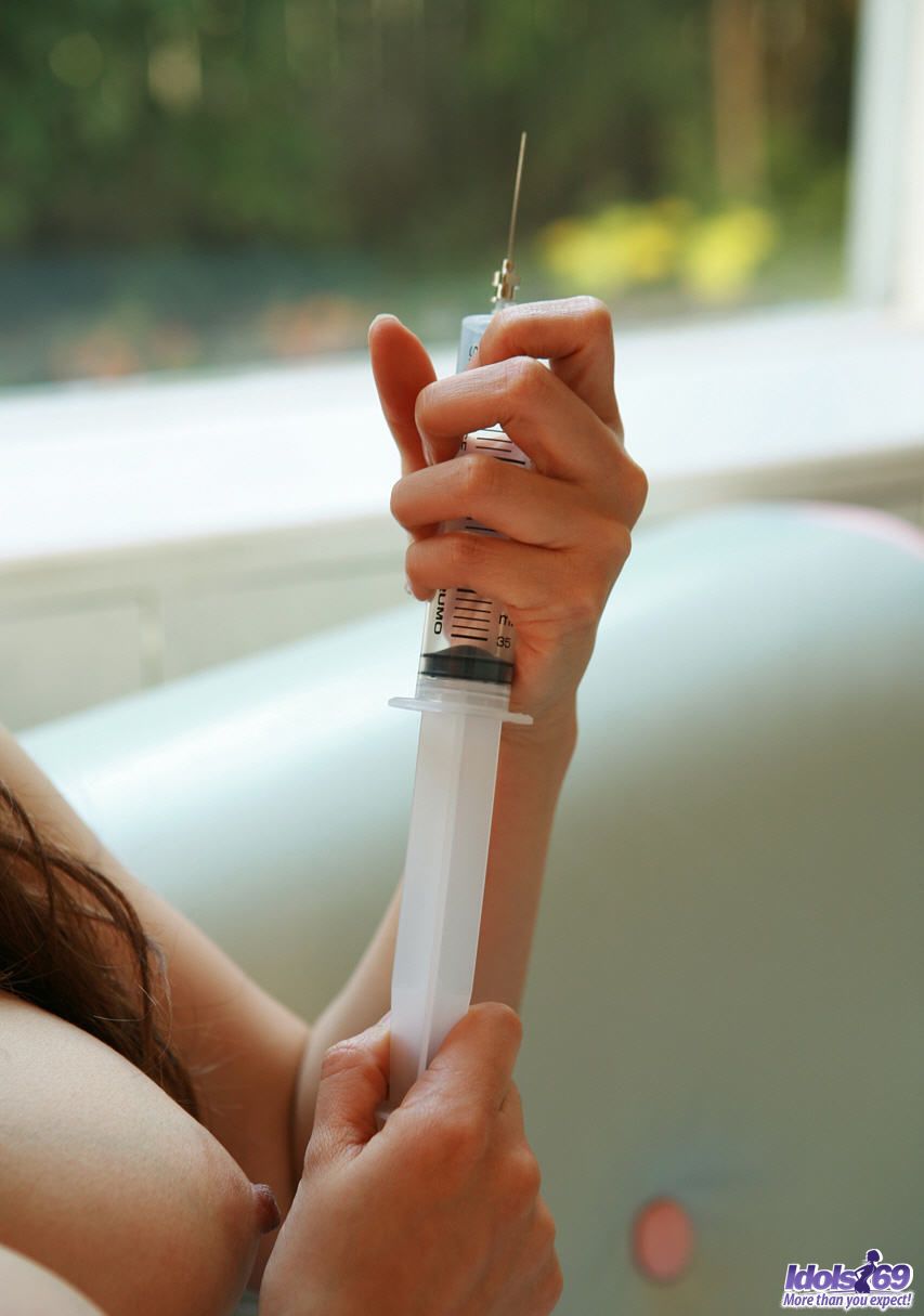 Kinky Japanese Nurse Namie Koshino Pokes Her Naked Body Parts With A Needle