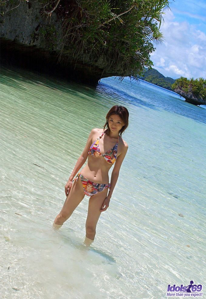Asian teen strips her bikini off and is enjoying the sun in the nude porno foto #429010672