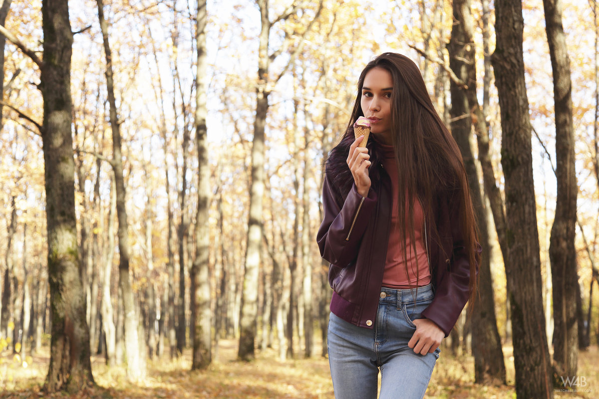 Nice Russian girl Leona Mia eats an ice cream treat in a forest while clothed porn photo #425268134