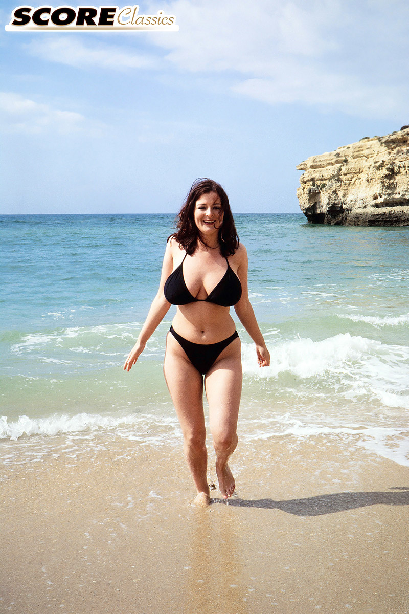 Brunette MILF Lorna Morgan releases her nice melons from bikini on a beach photo porno #424595090