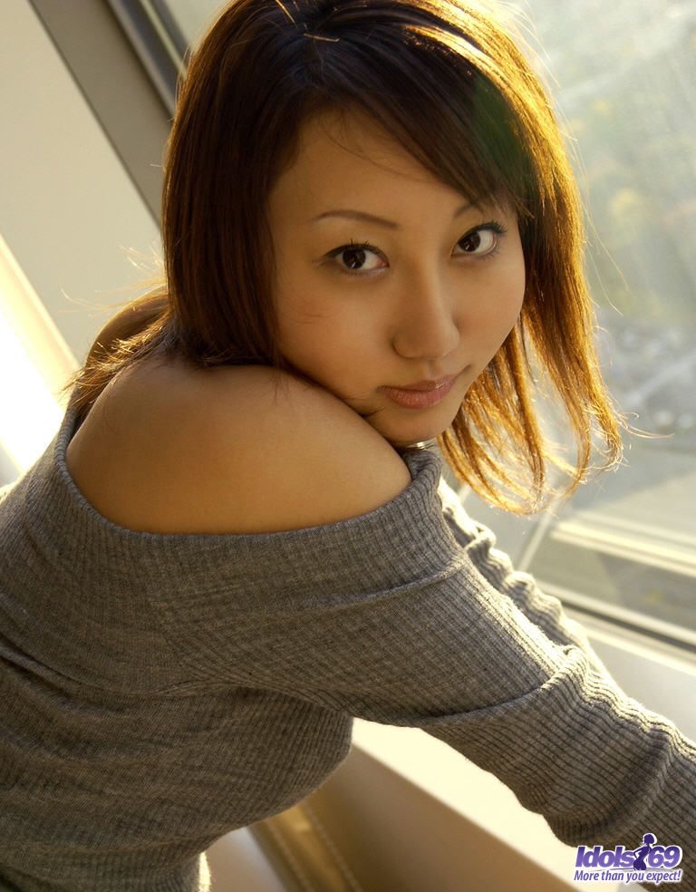 Japanese teen Shiho soaps up her bush while taking a bath after arriving home