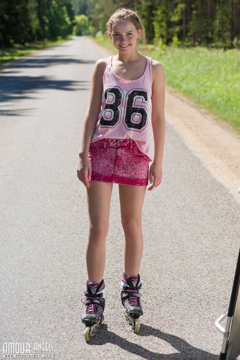 Young blonde girl Faina gets naked in middle of road wearing roller blades foto porno #424067461