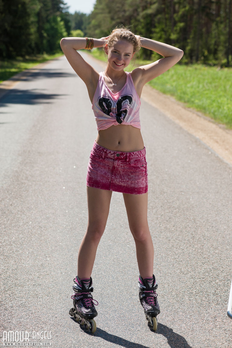 Young blonde girl Faina gets naked in middle of road wearing roller blades foto porno #424067463