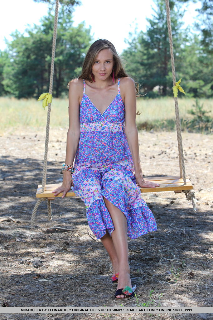 Long legged teen Mirabella doffs a dress to pose nude on a swing under a tree foto porno #425034958