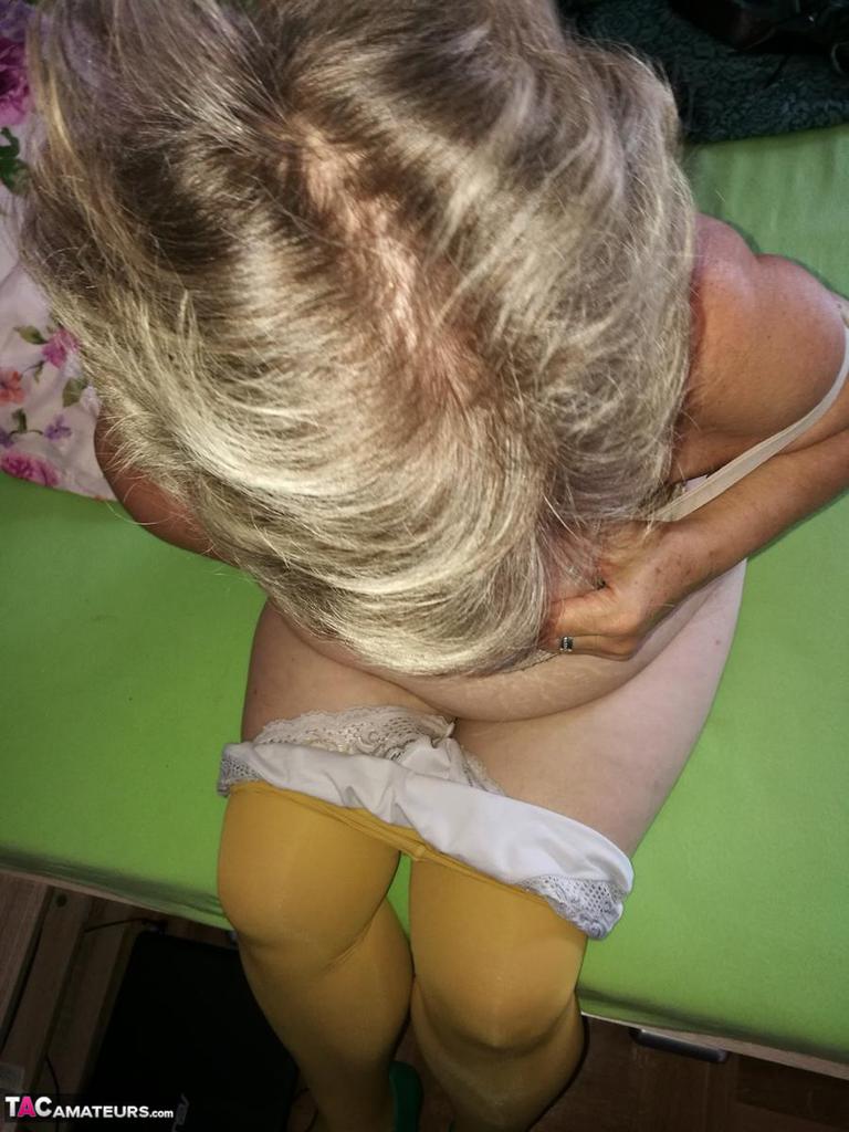 Old Woman Caro Releases Her Hairy Vagina From Yellow Pantyhose On Her Bed
