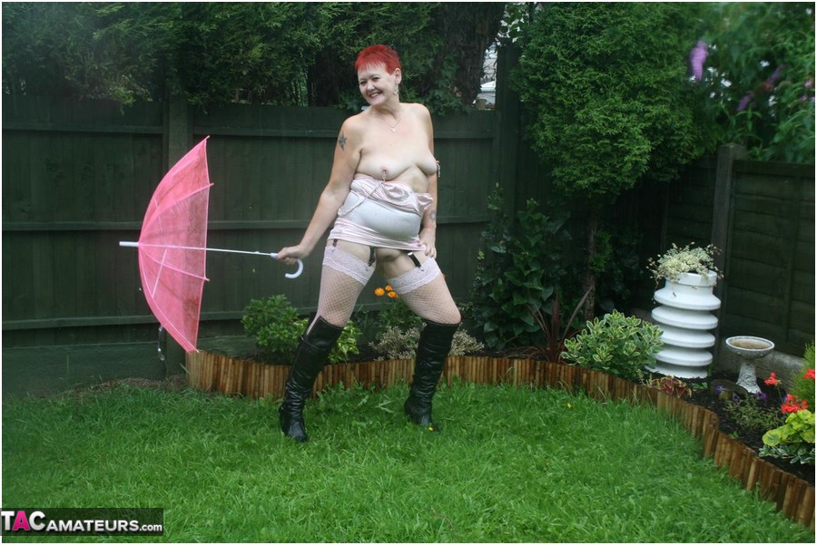 Older redhead Valgasmic Exposed models nude in the rain while holding a brolly porno fotky #424895920