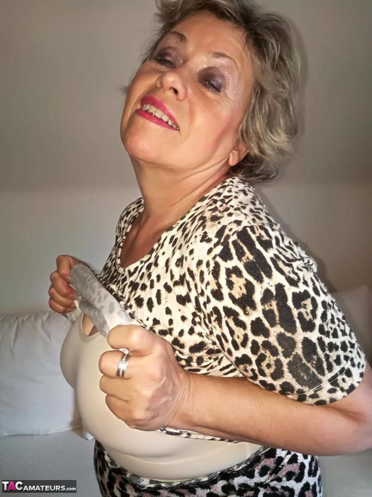 Horny nan Caro pets her snatch prior to fondling her natural breasts photo porno #424614020
