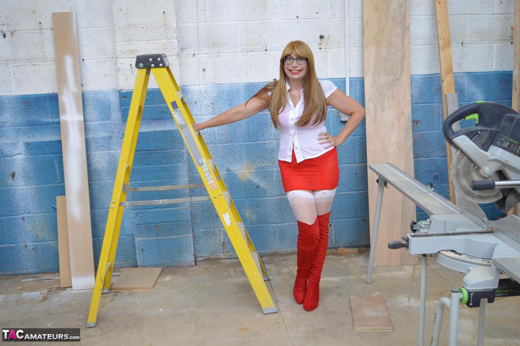 Middle-aged woman Barby Slut gets naked at a job site in OTK boots & nylons porn photo #428175292