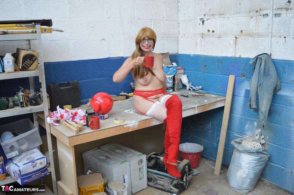 Middle-aged woman Barby Slut gets naked at a job site in OTK boots & nylons порно фото #428175305