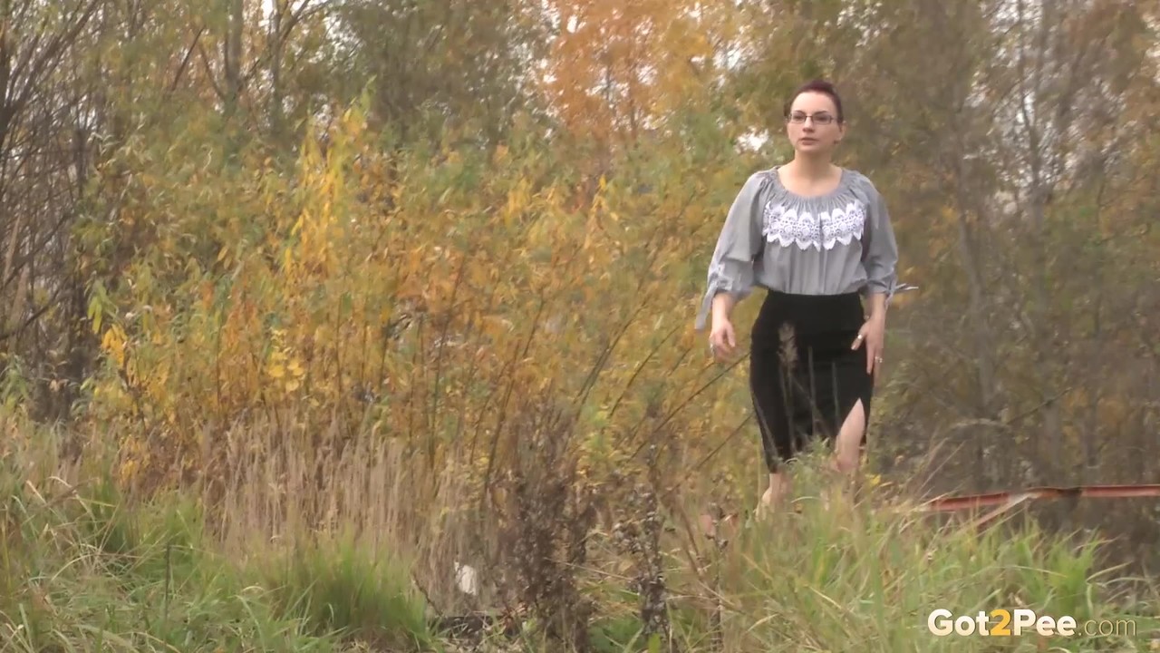 Unawares lady gets caught on spy cam hiking her skirt and taking a pee on path porn photo #426391801