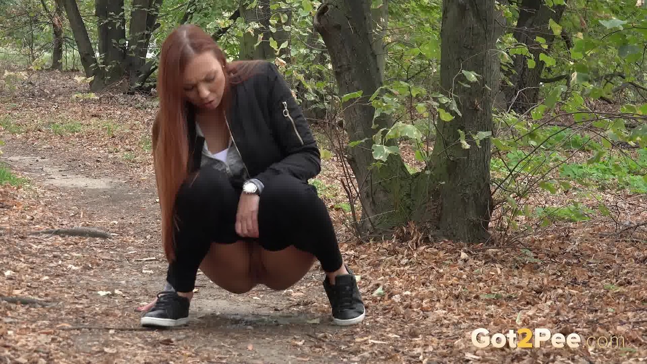 Redhead babe enjoys a messy pee in the woods foto porno #424760222