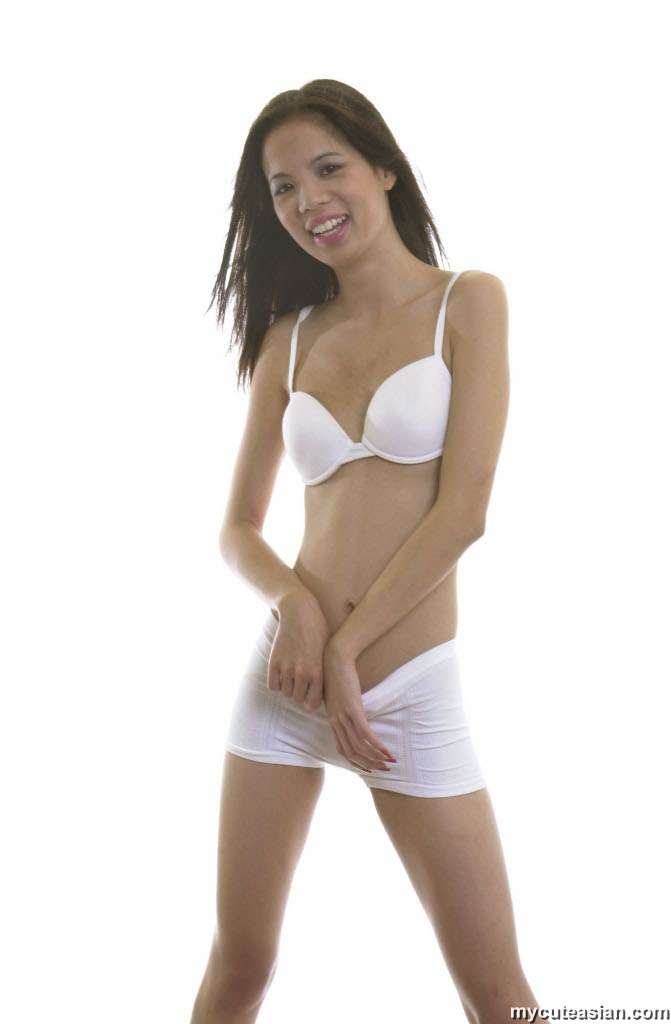 Thin Asian girl removes white bra and underwear to model without clothes on foto porno #427304909