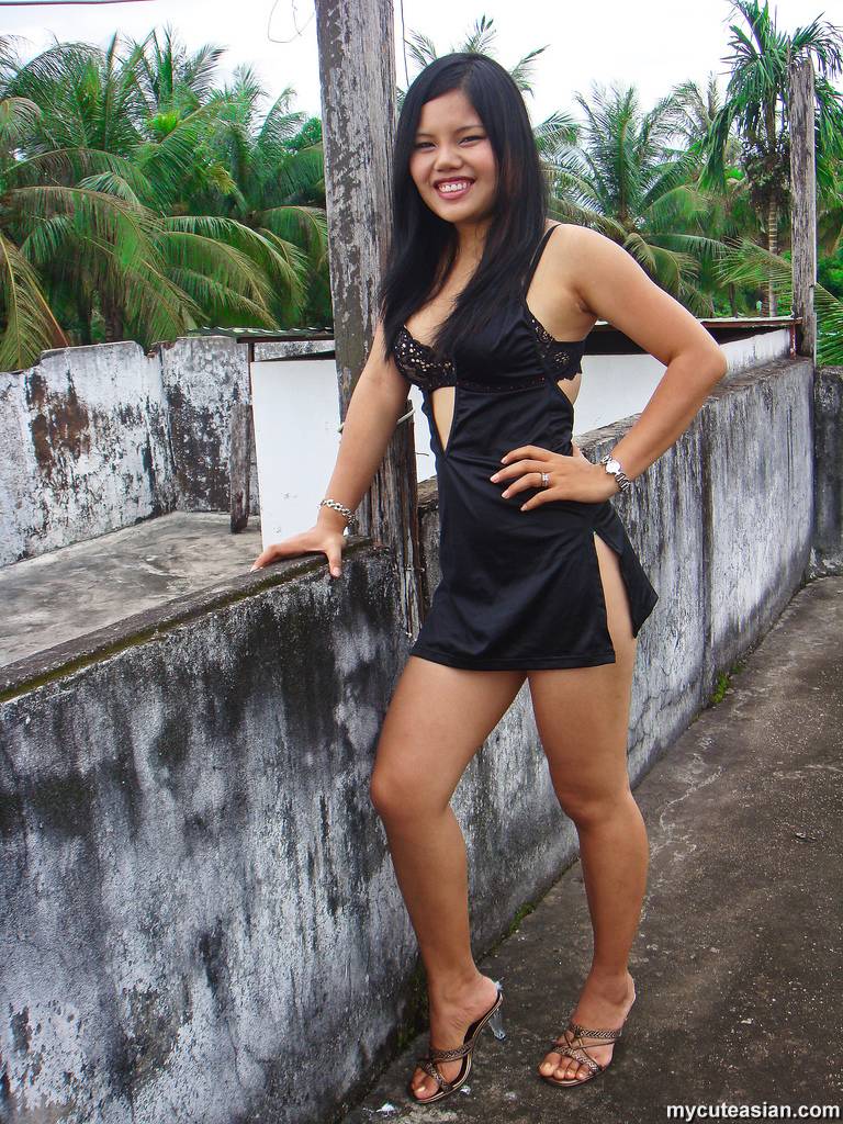 Filipino girl in a black dress shows her bare legs while modeling non nude porn photo #423750074