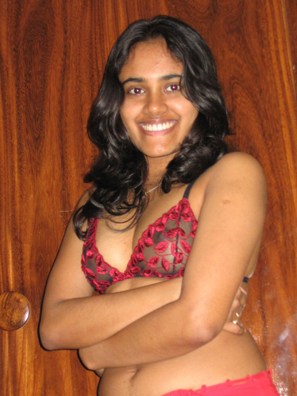 Indian girl with a nice smile shows her breasts on top of a bed ポルノ写真 #425059250