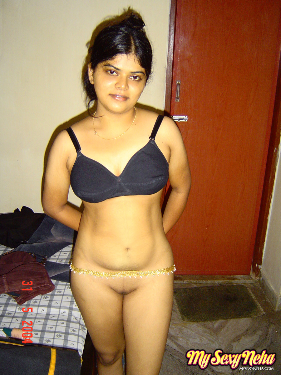Indian solo girl Neha stands totally naked after disrobing in bedroom porn photo #423948154