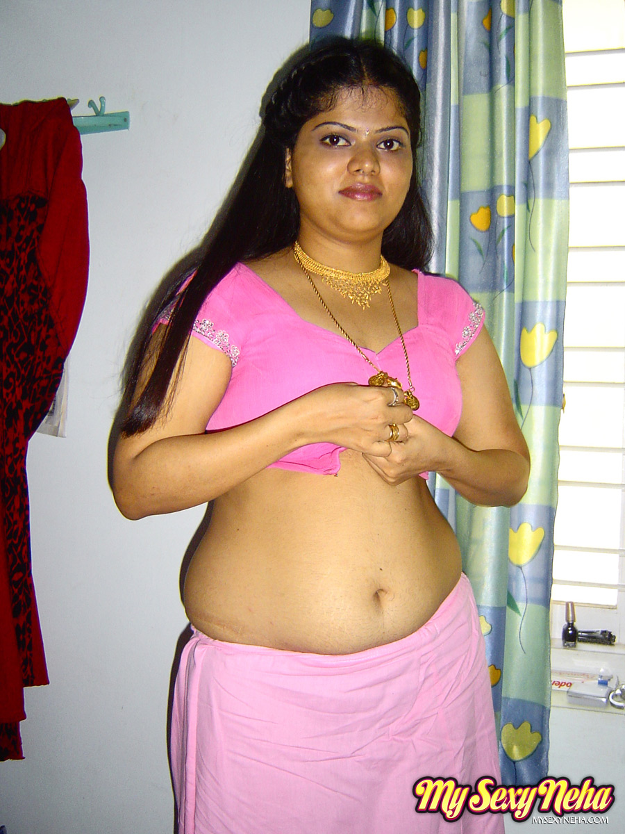 During her solo action, Neha the plump Indian girl exposes herself completely naked on her bed.