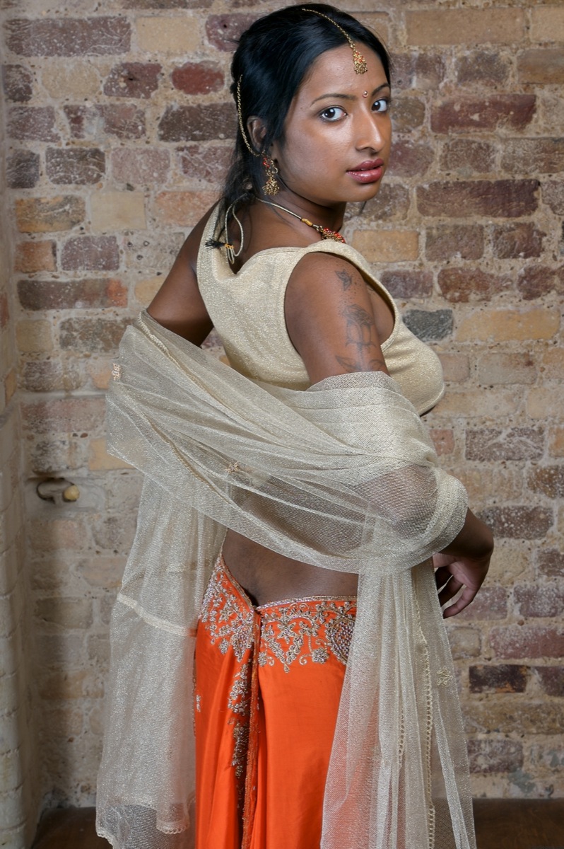 Indian model with tattoos exposes her firm tits in traditional clothing foto porno #423054200