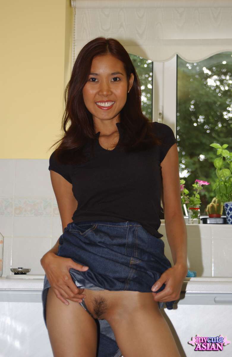 Leggy Asian amateur strips totally naked on her kitchen counter porn photo #426639496