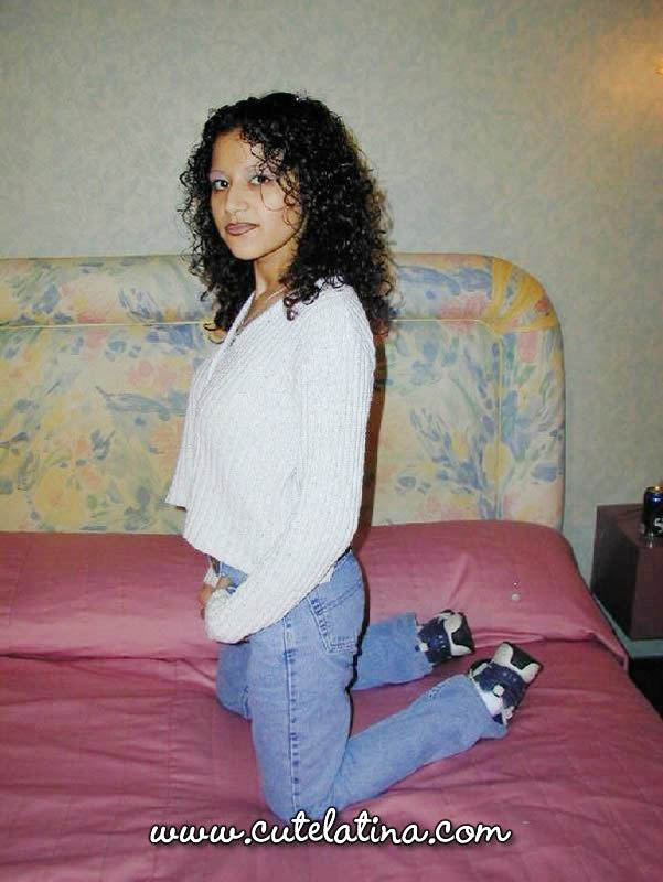 Latina girl with curly hair shows her bare ass on top of a bed foto porno #425220192
