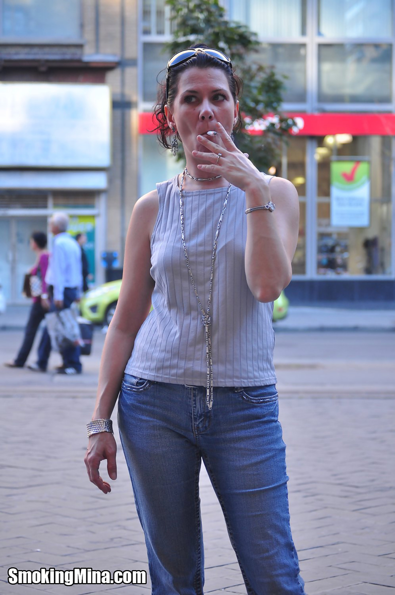 Brunette chick smokes a cigarette on a busy street while fully clothed zdjęcie porno #424141497 | Smoking Mina Pics, Smoking, mobilne porno