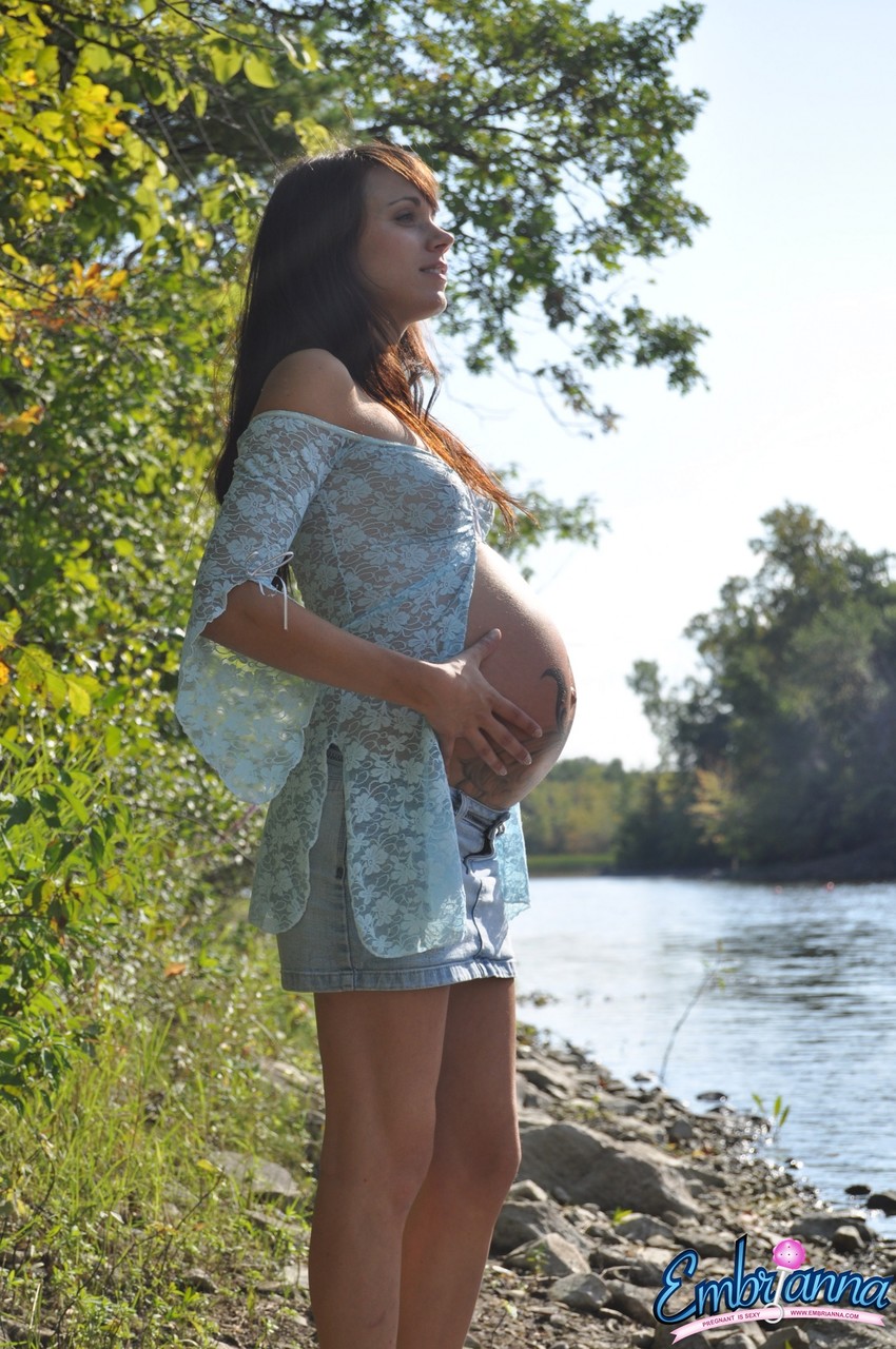 Solo girl Brianna exposes her pregnant belly on rocky shore beside a river Porno-Foto #427245875
