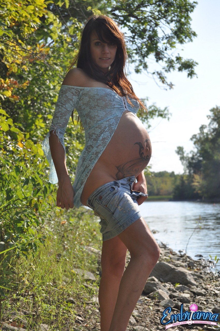 Solo girl Brianna exposes her pregnant belly on rocky shore beside a river photo porno #427245893
