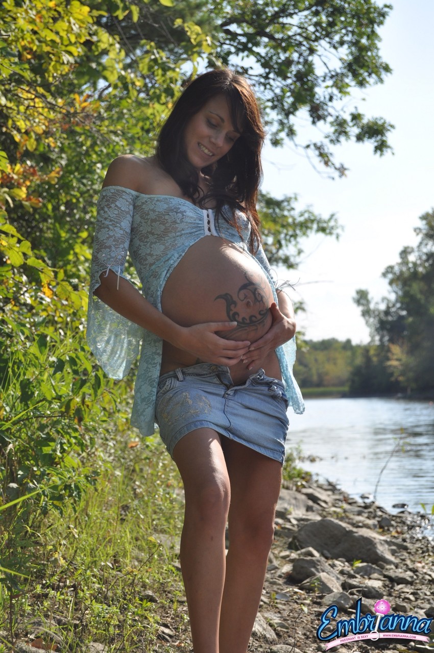 Solo girl Brianna exposes her pregnant belly on rocky shore beside a river Porno-Foto #427245897