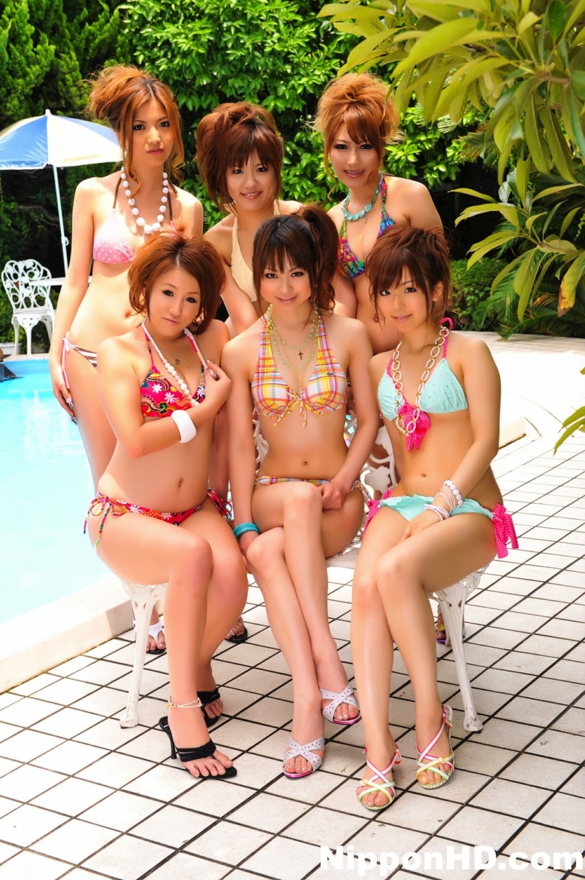 Japanese bikini models gather on a poolside patio for a group shoot porn photo #425374905