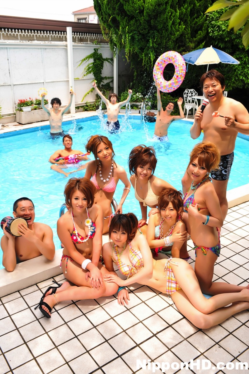 Japanese bikini models gather on a poolside patio for a group shoot porn photo #425374916