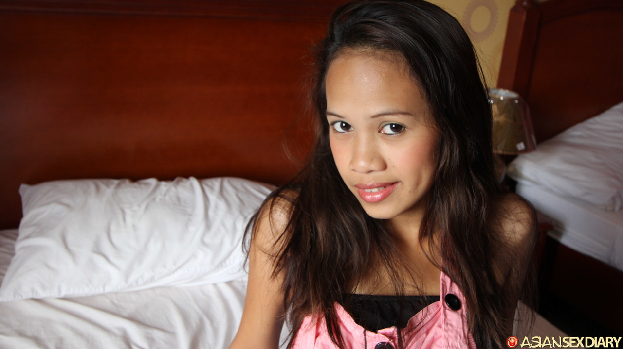 A POV blowjob is performed on a slim Asian amateur's face while wearing a jig.