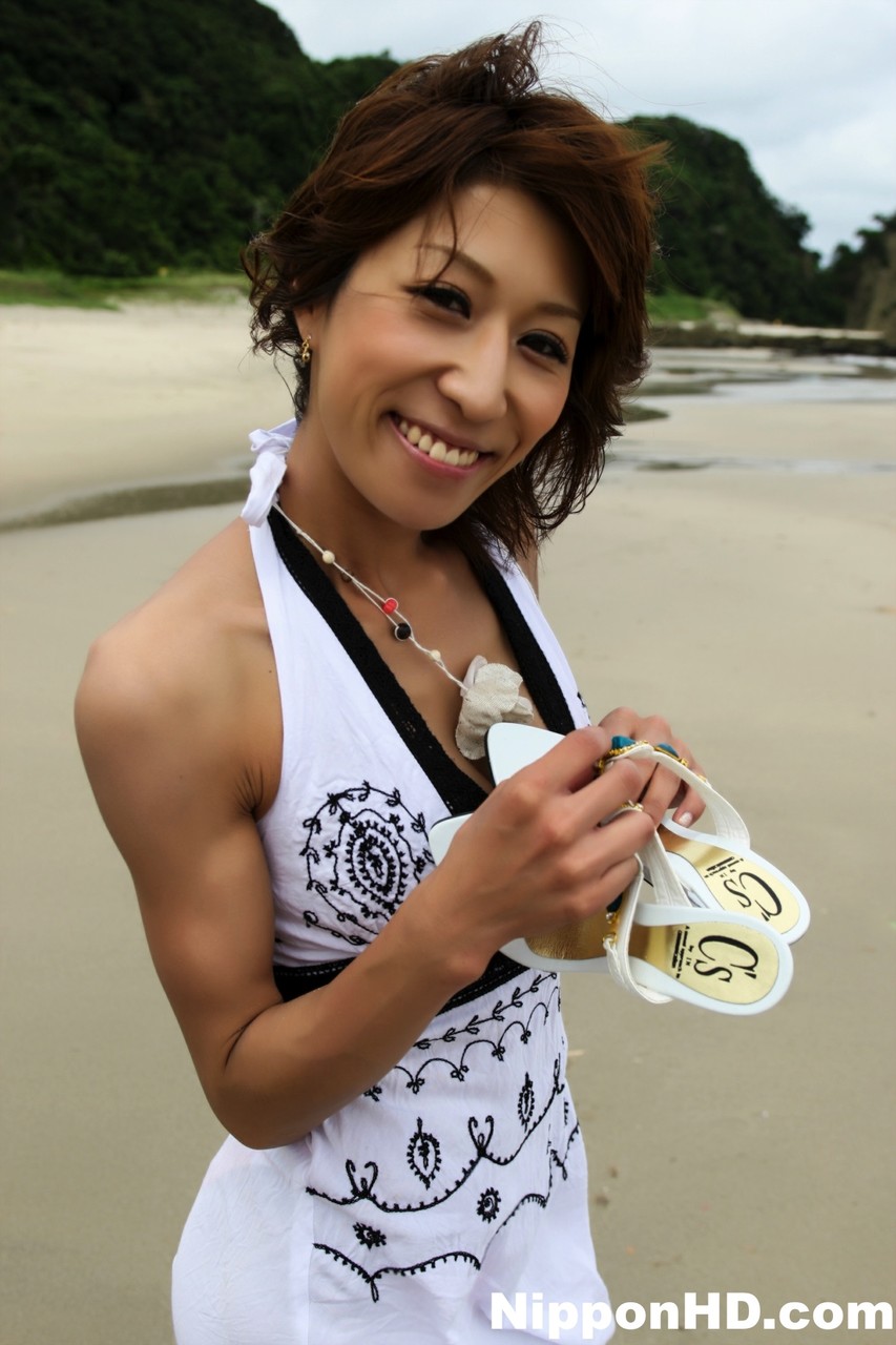 Japanese girl wears a bikini while playing in the ocean during a beach holiday porn photo #428452036