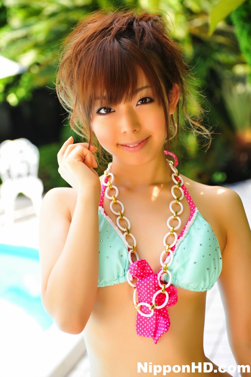Adorable Japanese girl models a pretty bikini on a poolside patio foto pornográfica #424653447