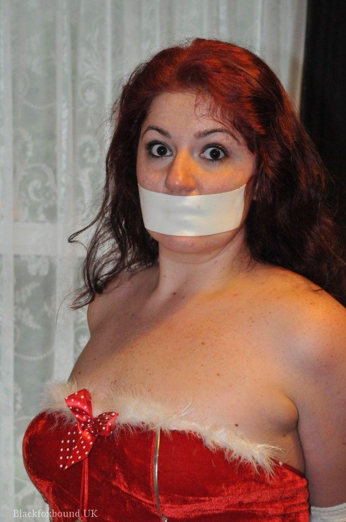 Redheaded solo girl shows her natural tits while restrained and gagged at Xmas foto porno #424917519