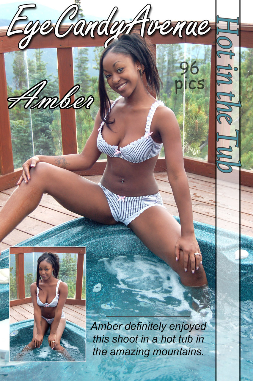 Black girl Amber uncups her big tits while getting in an outdoor hot tub foto porno #423429051