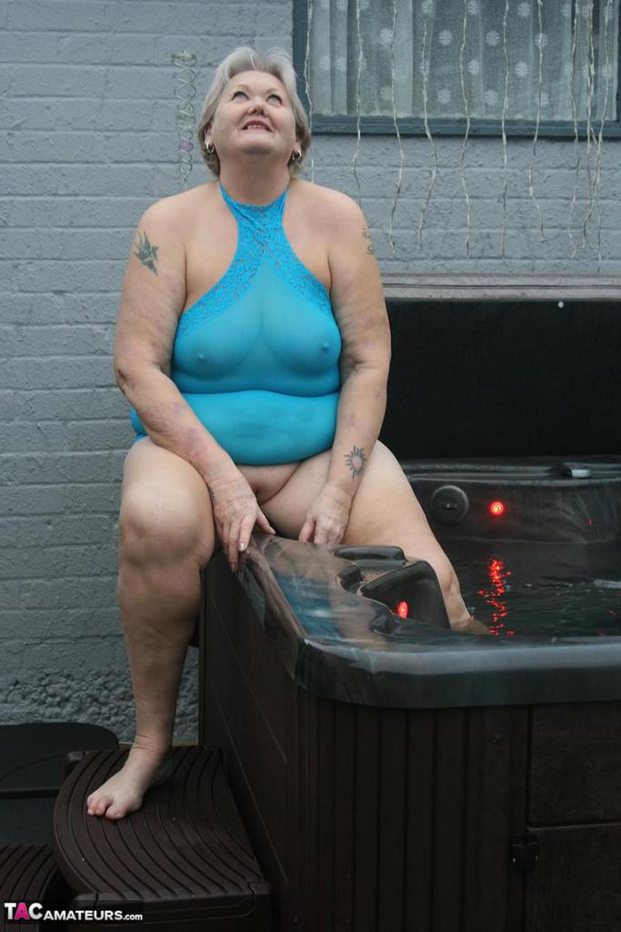 Old amateur frees tits and twat from tight dress before getting in hot tub porn photo #427332491 | TAC Amateurs Pics, Granny, mobile porn