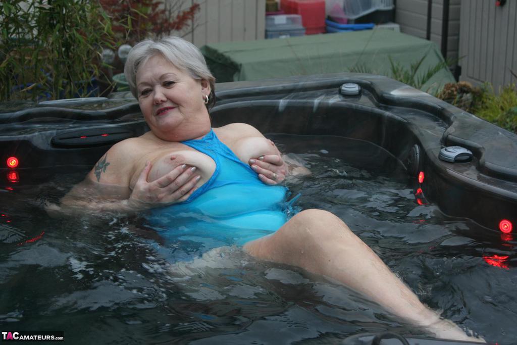 Old amateur frees tits and twat from tight dress before getting in hot tub porn photo #427332599 | TAC Amateurs Pics, Granny, mobile porn