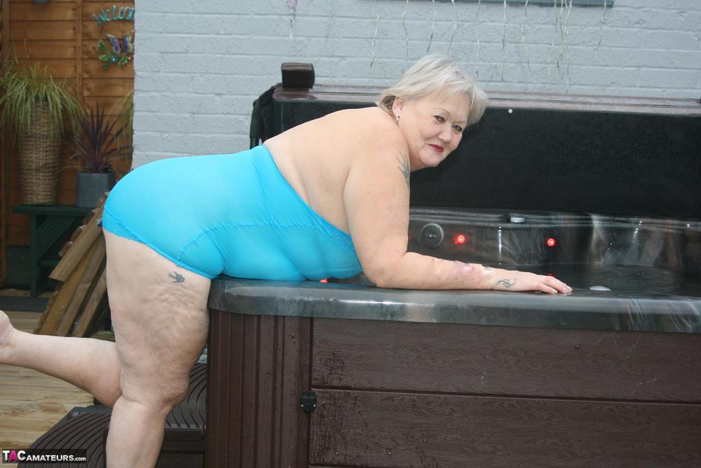 Old amateur frees tits and twat from tight dress before getting in hot tub porn photo #427332608 | TAC Amateurs Pics, Granny, mobile porn