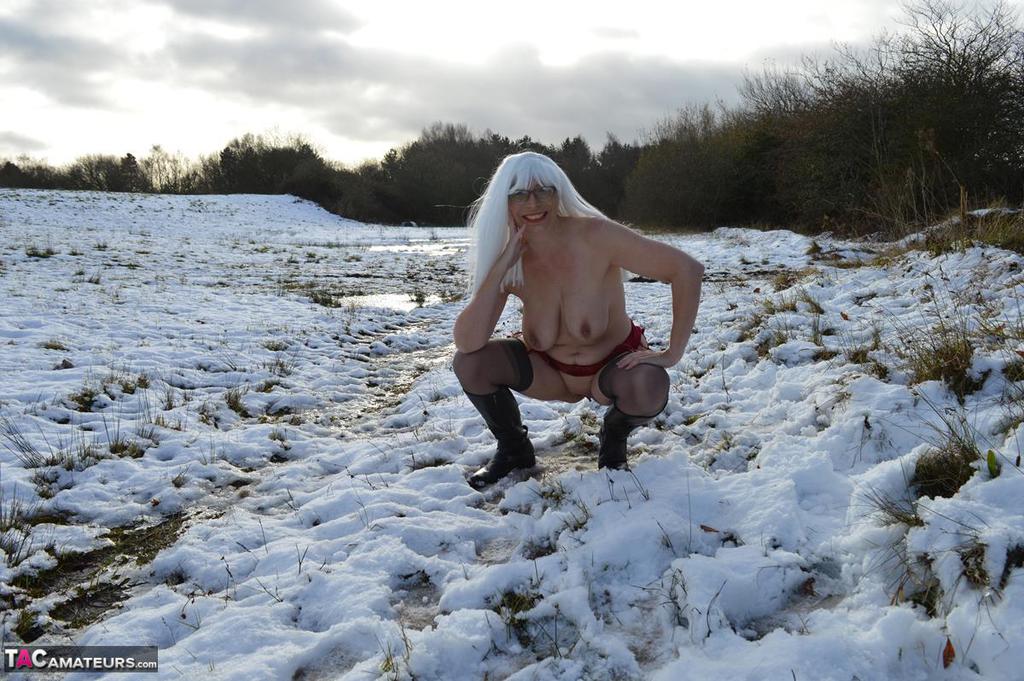 Mature platinum blonde gets naked on snow-covered ground in black boots foto porno #422941232 | TAC Amateurs Pics, Mature, porno ponsel