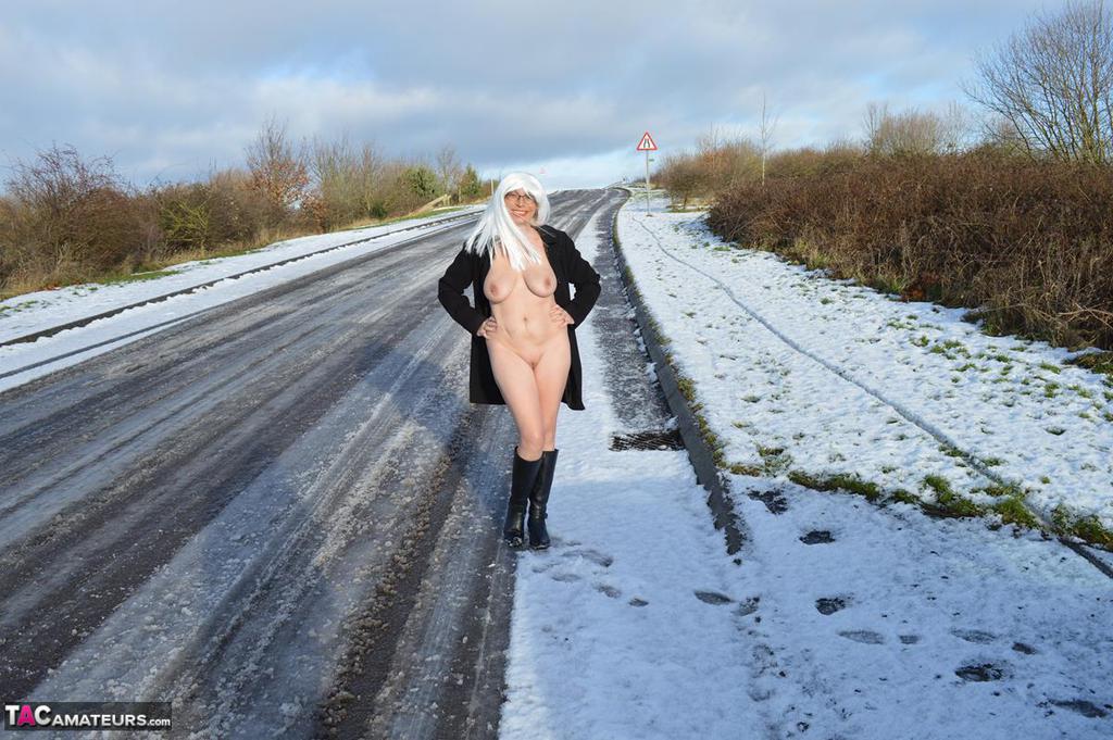 Mature platinum blonde gets naked on snow-covered ground in black boots foto porno #422941254