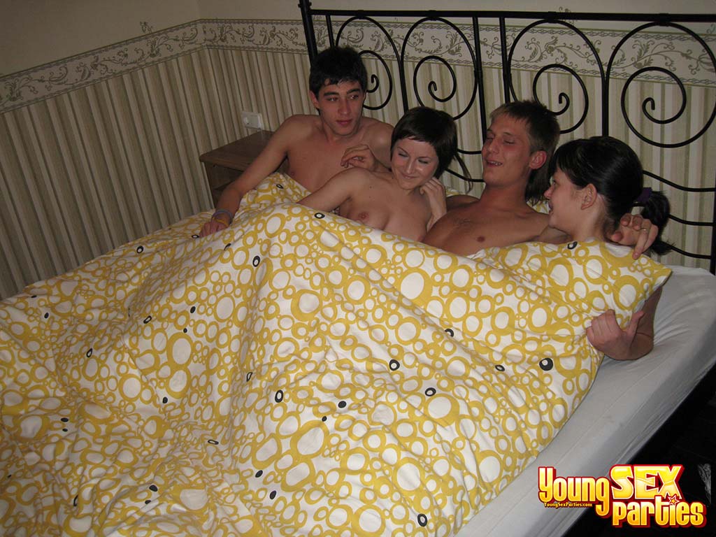Horny teenagers swap girlfriends during a foursome on a bed porn photo #424706759