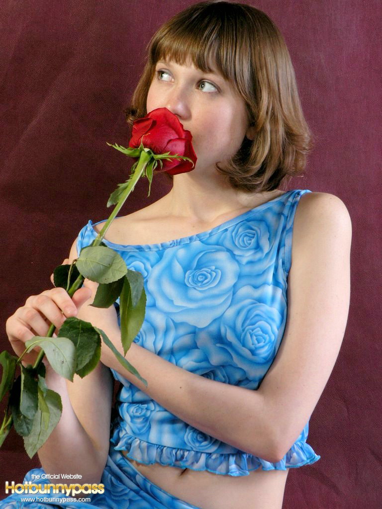 Adorable Teen Anabell Sniffs A Red Rose Before Taking Off Her Clothes