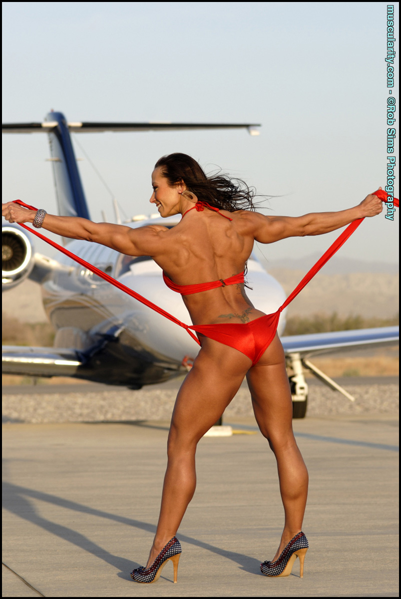 Bodybuilder Patricia Beckman Models A Red Bikini Afore A Private Jet