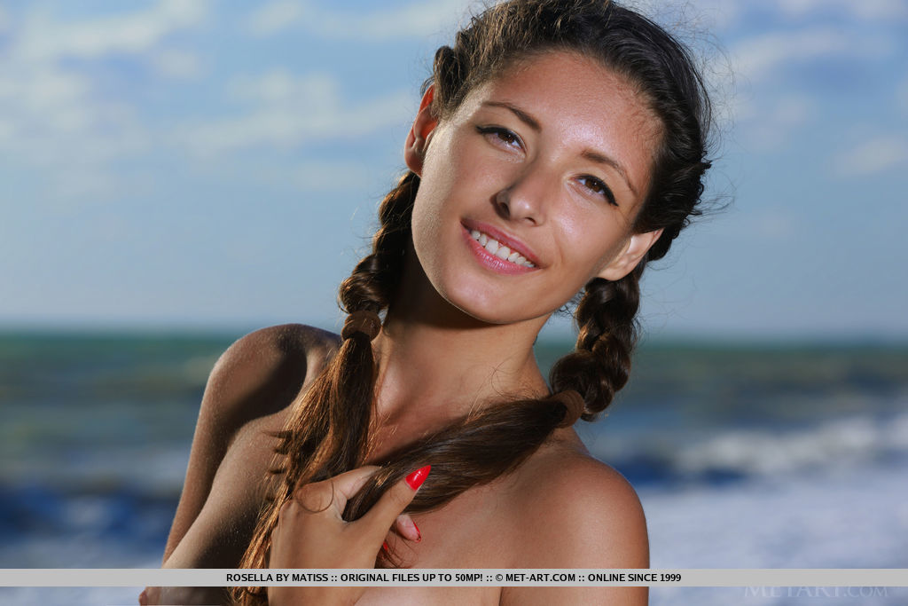 Teen girl Rosella plays with pigtails before taking off her bikini on a beach porn photo #426838585