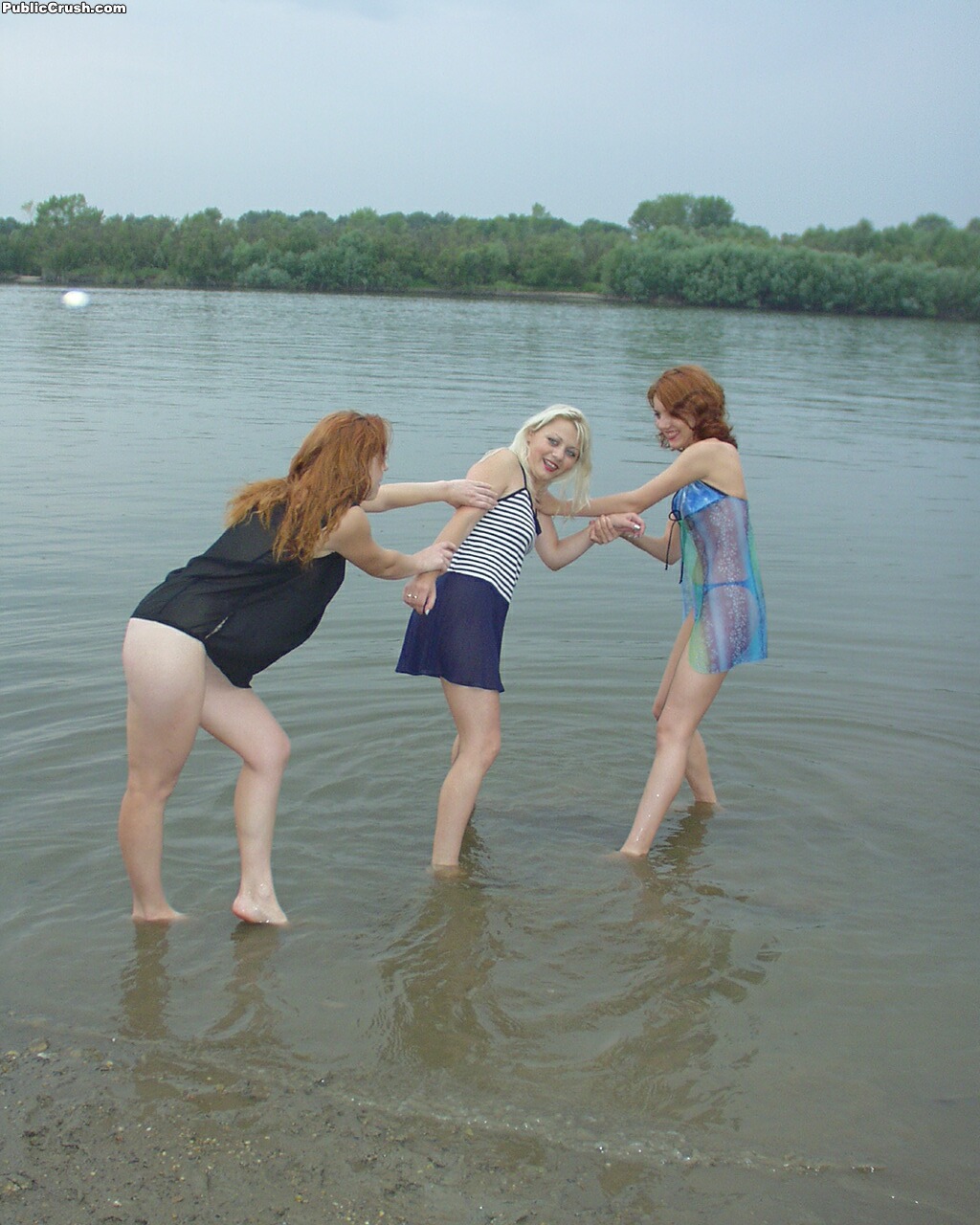 Teen girls partially remove wet clothing after wading into a river photo porno #427850447