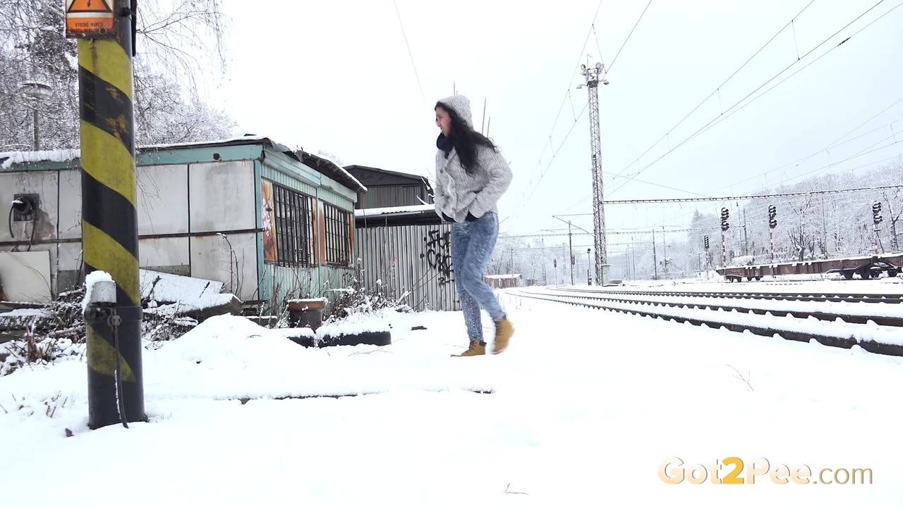 Distressed girl Esperansa takes an urgent piss on snow-covered ground porn photo #425323687