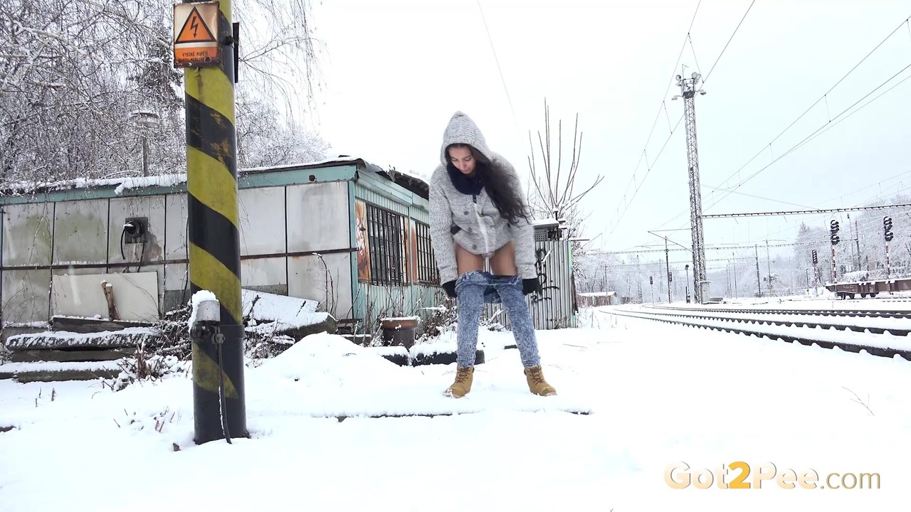 Distressed girl Esperansa takes an urgent piss on snow-covered ground porn photo #425323691