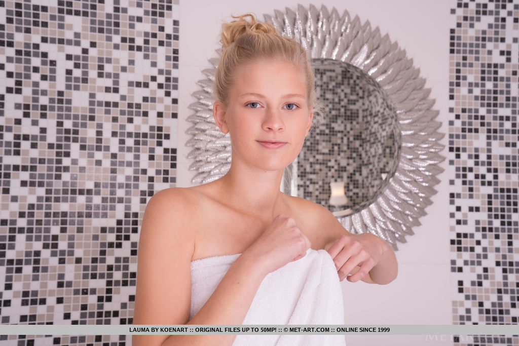 Young looking blonde Lauma removes a bath towel before getting in the bathtub porn photo #424344344