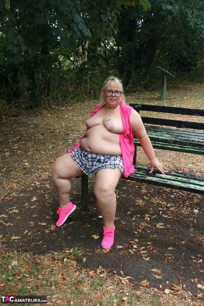 The naked Lexie Cummings, an obese British amateur athlete from the United Kingdom, exposes herself on a public picnic table.