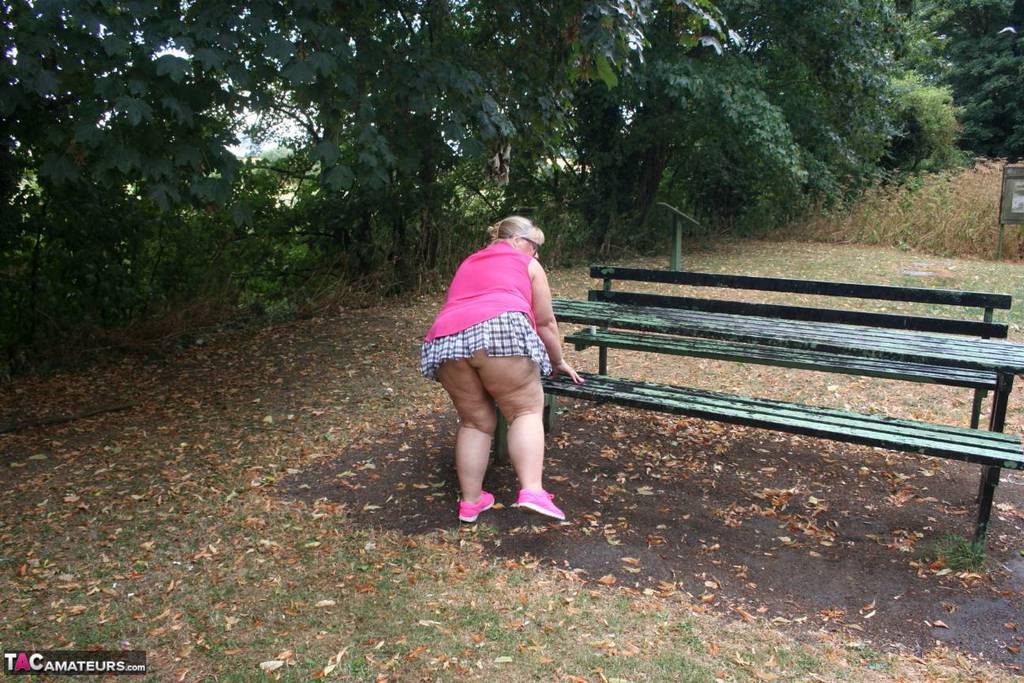 Lexie Cummings, a British amateur who is elderly and in good physical shape, exposes herself on a public picnic table.