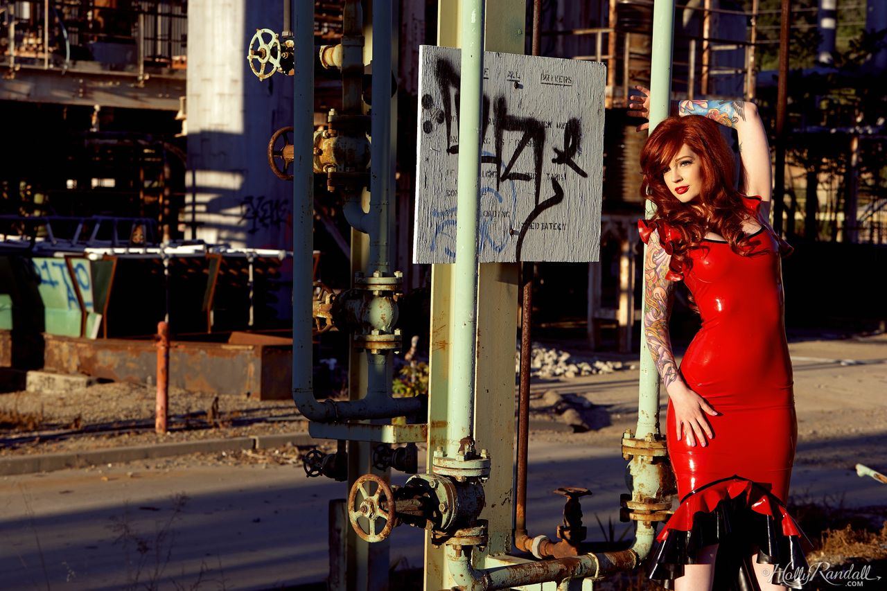 Hot Redhead Vanessa Lake Takes Off A Latex Dress To Go Nude On Rusty Steps